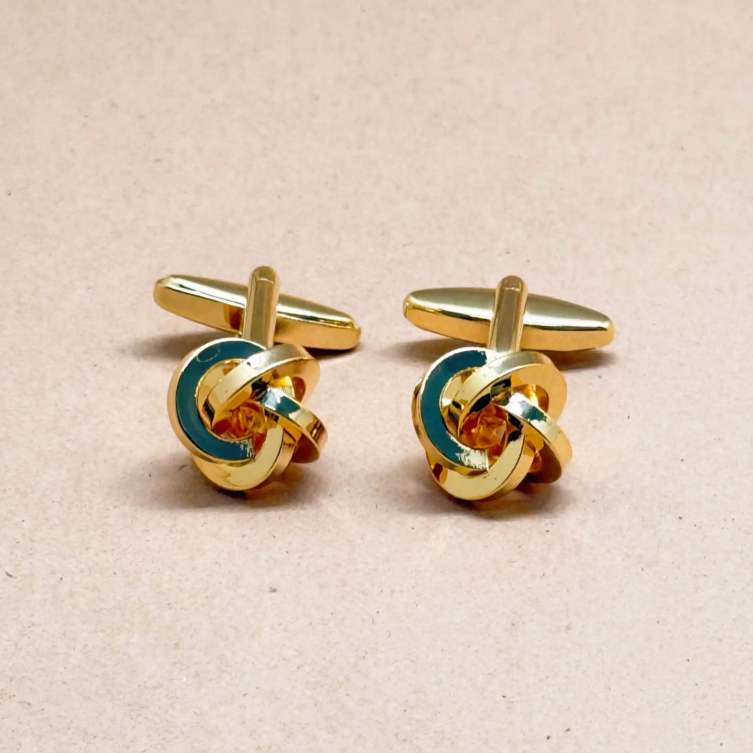 uc Twist Knot Enamel Gold Cufflinks - Image 1